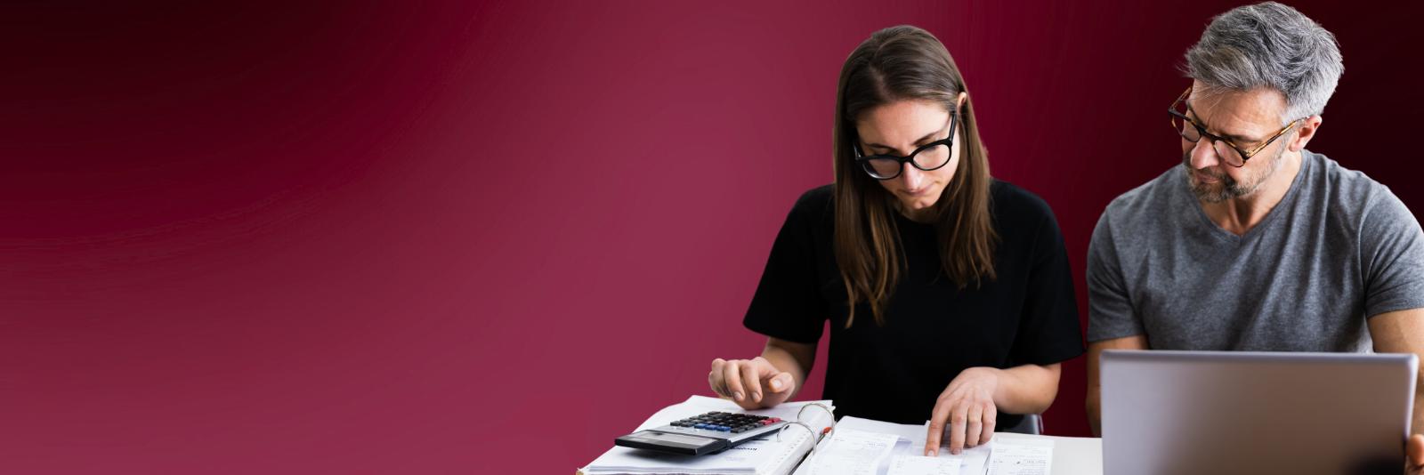 Woman and man looking at budget for planning